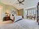 Spacious main bedroom with vaulted ceilings, neutral colors, and large windows for plenty of natural light at 10904 Eagle Run Dr, Parker, CO 80138