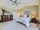 Inviting main bedroom featuring soft lighting, decorative furniture, and an upholstered king-size bed at 10904 Eagle Run Dr, Parker, CO 80138