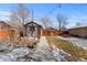 Landscaped backyard with a storage shed and patio area at 2740 N Fillmore St, Denver, CO 80205