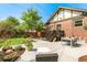 Beautiful backyard with a patio, lush lawn, and garden, perfect for outdoor entertaining and relaxation at 2740 N Fillmore St, Denver, CO 80205