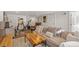 Cozy basement space with sectional sofa and exercise equipment at 2740 N Fillmore St, Denver, CO 80205