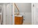 Well-lit bathroom featuring a wooden vanity with marble countertop at 2740 N Fillmore St, Denver, CO 80205