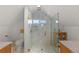 Modern bathroom with glass shower, tiled walls, and wooden vanity at 2740 N Fillmore St, Denver, CO 80205