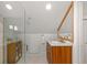 Modern bathroom featuring glass enclosed shower and wooden vanity at 2740 N Fillmore St, Denver, CO 80205