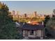 Scenic view of city skyline framed by lush greenery and rooftop at 2740 N Fillmore St, Denver, CO 80205