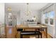 Dining area with hardwood floors and large windows at 2740 N Fillmore St, Denver, CO 80205