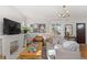 Living room with fireplace, large windows, and ample natural light at 2740 N Fillmore St, Denver, CO 80205