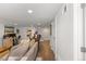 Modern living room with hardwood floors, recessed lighting, and a comfortable gray sofa with neutral pillows at 2740 N Fillmore St, Denver, CO 80205
