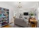 Living room with hardwood floors, fireplace, and built-in shelving at 2740 N Fillmore St, Denver, CO 80205