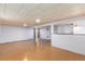 Spacious basement featuring a bar, offering potential for customization and various uses at 5582 E Colorado Ave, Denver, CO 80222