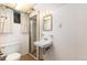 Basement bathroom featuring a shower, toilet and sink, providing convenience and functionality at 5582 E Colorado Ave, Denver, CO 80222
