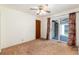 Bedroom featuring a ceiling fan, closet, and sliding glass door to the patio at 5582 E Colorado Ave, Denver, CO 80222