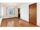 Dining area with hardwood floors, chandelier, and a window with natural lighting at 5582 E Colorado Ave, Denver, CO 80222