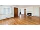 Inviting living room with hardwood floors, a fireplace, and ample natural light at 5582 E Colorado Ave, Denver, CO 80222