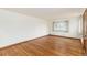 Spacious living room showcasing hardwood floors and a large window at 5582 E Colorado Ave, Denver, CO 80222