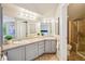 Double vanity bathroom with a shower at 1310 S Monaco Pkwy # 23, Denver, CO 80224