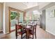 Cozy dining area featuring wood floors, large windows, and space for a table that seats four people at 1310 S Monaco Pkwy # 23, Denver, CO 80224