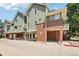 Well-maintained multi-level exterior features durable siding, brick accents, and ample parking at 1310 S Monaco Pkwy # 23, Denver, CO 80224