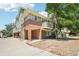 Inviting townhouse featuring brick accents, a covered entry, and convenient access to parking at 1310 S Monaco Pkwy # 23, Denver, CO 80224