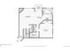 Detailed first floor plan showing the layout of the kitchen, living room, bedroom, and balcony at 1310 S Monaco Pkwy # 23, Denver, CO 80224