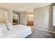 Spacious main bedroom with plush carpeting, ensuite bathroom access, and a serene, neutral color palette at 1310 S Monaco Pkwy # 23, Denver, CO 80224