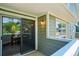 View of patio with glass doors leading to the interior of the home at 1310 S Monaco Pkwy # 23, Denver, CO 80224
