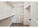 Walk-in Closet with wire shelving and carpeted floor at 1310 S Monaco Pkwy # 23, Denver, CO 80224
