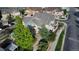A high angle aerial view of a neighborhood featuring townhomes, landscaping, and walking paths at 23560 Alamo Pl # B, Aurora, CO 80016