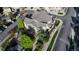 Aerial view showcasing a townhome with mature trees, green spaces, and winding streets creating a picturesque neighborhood at 23560 Alamo Pl # B, Aurora, CO 80016