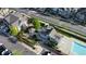 Stunning aerial view of the community pool, playground, common outdoor facilities, and surrounding neighborhood at 23560 Alamo Pl # B, Aurora, CO 80016