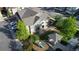Aerial view of townhome complex with playground and manicured green spaces, offering a serene community atmosphere at 23560 Alamo Pl # B, Aurora, CO 80016