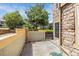 Well-maintained backyard with a stone wall, small grassy area, and privacy fence for outdoor living and relaxation at 23560 Alamo Pl # B, Aurora, CO 80016