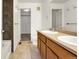 Bathroom featuring a double sink vanity, tiled floors, and a bathtub-shower combo at 23560 Alamo Pl # B, Aurora, CO 80016