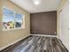Bedroom with a window and closet, showcasing a clean and organized space at 23560 Alamo Pl # B, Aurora, CO 80016