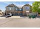 Charming townhome with attached garages, lush landscaping, and stone accents offering a blend of comfort and curb appeal at 23560 Alamo Pl # B, Aurora, CO 80016