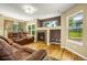 Cozy living room features a fireplace, hardwood floors, and lots of natural light at 23560 Alamo Pl # B, Aurora, CO 80016