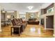 Bright living room with hardwood floors, a fireplace, and comfortable seating at 23560 Alamo Pl # B, Aurora, CO 80016