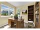 Bright office space with large windows and a wooden desk at 23560 Alamo Pl # B, Aurora, CO 80016
