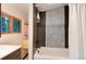 Bathroom featuring a tiled shower over bath, and sleek fixtures at 21221 Colorado 103, Idaho Springs, CO 80452