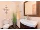 Charming powder room boasts modern fixtures, a unique vanity, and stylish decor accents at 21221 Colorado 103, Idaho Springs, CO 80452