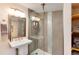 Bathroom featuring glass-door shower and tiled walls at 21221 Colorado 103, Idaho Springs, CO 80452