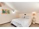 Cozy bedroom with natural light, sloped ceilings, and comfortable bed. A peaceful retreat at 21221 Colorado 103, Idaho Springs, CO 80452
