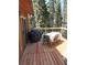 Beautiful deck with seating, barbecue, and serene views of the surrounding forest at 21221 Colorado 103, Idaho Springs, CO 80452
