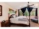 Bright main bedroom with king bed, wood floors and large window views at 21221 Colorado 103, Idaho Springs, CO 80452