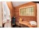 Inviting home sauna, featuring wood paneling, built-in benches, and a window for natural light at 21221 Colorado 103, Idaho Springs, CO 80452
