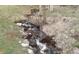 Natural stream flowing through the property, enhanced with rocks and natural foliage at 21221 Colorado 103, Idaho Springs, CO 80452