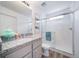 Bathroom with granite countertop, single sink and shower at 45032 Sunflower Ln, Bennett, CO 80102