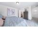 Spacious bedroom with a king-size bed and en-suite bathroom at 45032 Sunflower Ln, Bennett, CO 80102