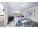 Main bedroom with king bed and access to a private deck at 45032 Sunflower Ln, Bennett, CO 80102