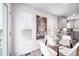 Bright dining area with glass table and white chairs near kitchen at 45032 Sunflower Ln, Bennett, CO 80102